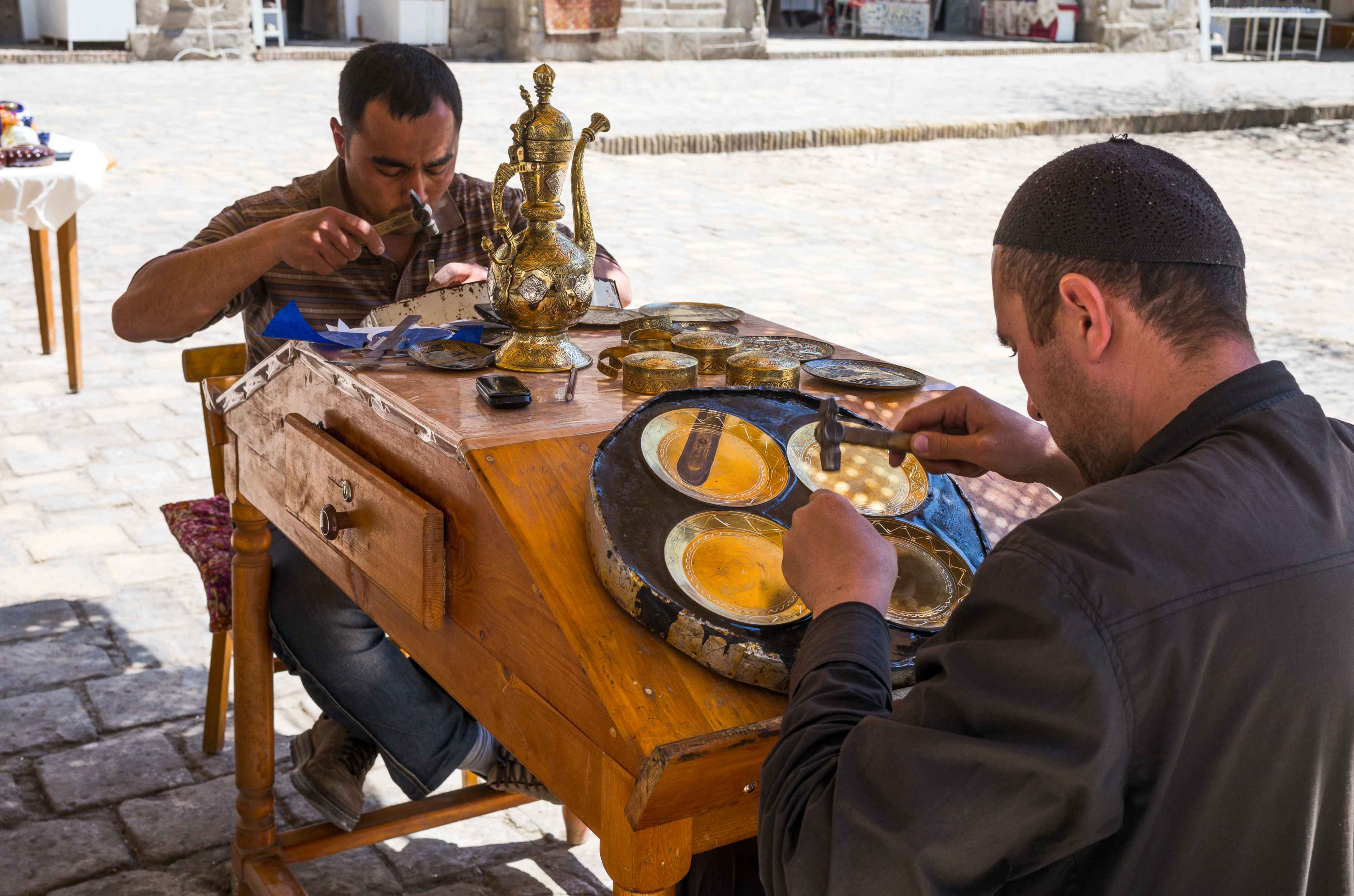 Bukhara, Uzbekistan - April 16, 2014 : Craftsmen at work in the Taqi Sarrafon market in the old city center